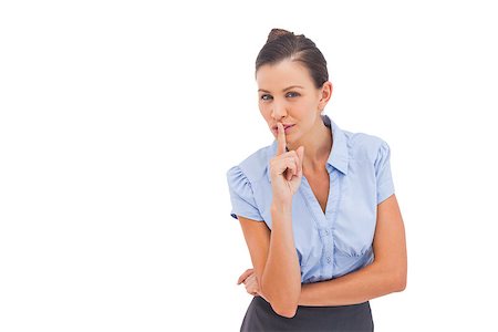 simsearch:400-06883455,k - Businesswoman with finger on lips looking at the camera Photographie de stock - Aubaine LD & Abonnement, Code: 400-06883455