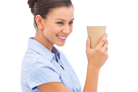 simsearch:400-06883455,k - Cheerful businesswoman holding a coffee cup and looking away Photographie de stock - Aubaine LD & Abonnement, Code: 400-06883480