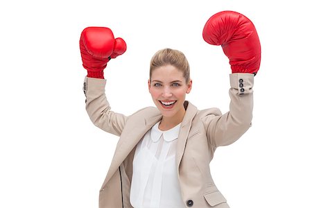 portrait of woman wearing boxing gloves - A cheering businesswoman wearing boxing gloves with arms raised Stock Photo - Budget Royalty-Free & Subscription, Code: 400-06883582