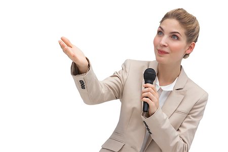 simsearch:400-06883455,k - Businesswoman with microphone pointing at something with her hands Photographie de stock - Aubaine LD & Abonnement, Code: 400-06883628