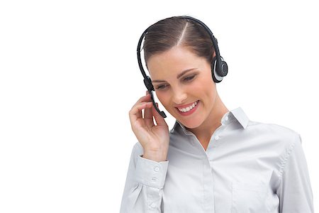 simsearch:400-06883455,k - A smiling businesswoman listening and talking on headset Photographie de stock - Aubaine LD & Abonnement, Code: 400-06883658