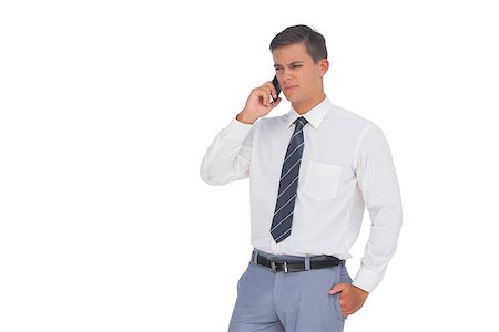 simsearch:400-07139155,k - Unsmiling businessman on the phone on white background Stock Photo - Budget Royalty-Free & Subscription, Code: 400-06883737