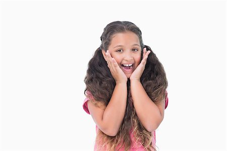 simsearch:400-06890095,k - Little girl is surprising and smiling at camera on white background Stock Photo - Budget Royalty-Free & Subscription, Code: 400-06890078