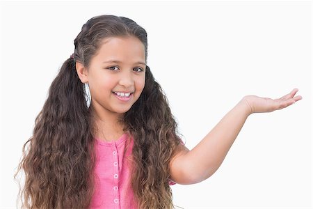 simsearch:400-06890095,k - Little girl presenting something on white background Stock Photo - Budget Royalty-Free & Subscription, Code: 400-06890080