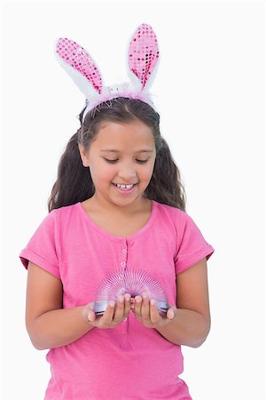 simsearch:400-06890095,k - Little girl wearing rabbit ears and holding spring on white background Stock Photo - Budget Royalty-Free & Subscription, Code: 400-06890094