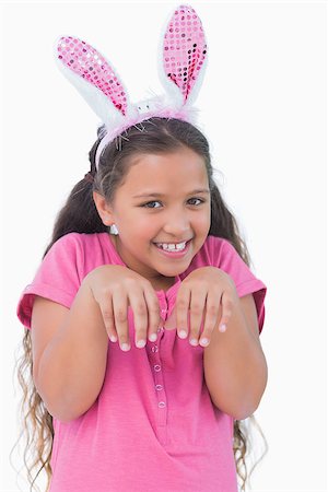 simsearch:400-06890095,k - Little girl does an imitation of rabbit on white background Stock Photo - Budget Royalty-Free & Subscription, Code: 400-06890095