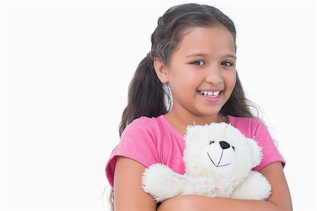 small little girl pic to hug a teddy - Little girl holding her teddy bear on white background Stock Photo - Budget Royalty-Free & Subscription, Code: 400-06890090