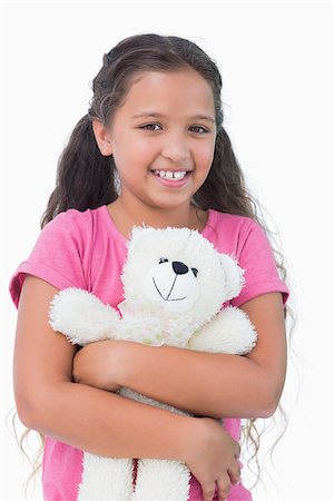 small little girl pic to hug a teddy - Cute little girl holding her teddy bear on white background Stock Photo - Budget Royalty-Free & Subscription, Code: 400-06890091