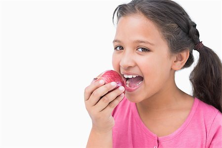 simsearch:400-06890095,k - Little girl eating apple on white background Stock Photo - Budget Royalty-Free & Subscription, Code: 400-06890102