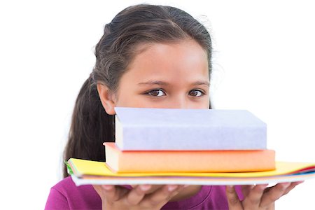 simsearch:400-06890095,k - Little girl holding her homework and looking at camera on white background Stock Photo - Budget Royalty-Free & Subscription, Code: 400-06890129