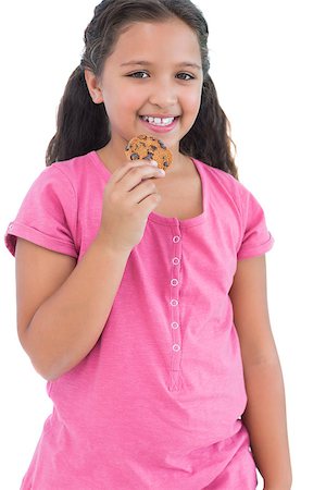 simsearch:400-06890095,k - Little girl eating a cookie on white background Stock Photo - Budget Royalty-Free & Subscription, Code: 400-06890122