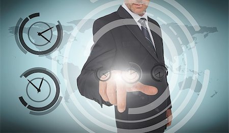 simsearch:6109-07601583,k - Businessman selecting a screen with dials around him and a world map on the background Stock Photo - Budget Royalty-Free & Subscription, Code: 400-06890248