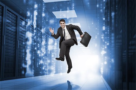 data center business - Businessman jumping in a data center corridor Stock Photo - Budget Royalty-Free & Subscription, Code: 400-06890354