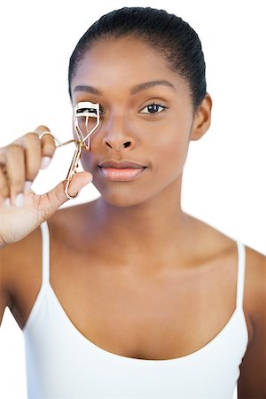 simsearch:400-06890736,k - Woman using curler for her eyelash on white background Stock Photo - Budget Royalty-Free & Subscription, Code: 400-06890706