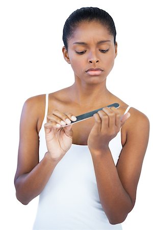 simsearch:400-06890736,k - Serious woman using nail file on white background Stock Photo - Budget Royalty-Free & Subscription, Code: 400-06890720