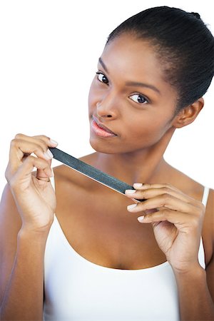 simsearch:400-06890736,k - Brunette holding her nail file on white background Stock Photo - Budget Royalty-Free & Subscription, Code: 400-06890732