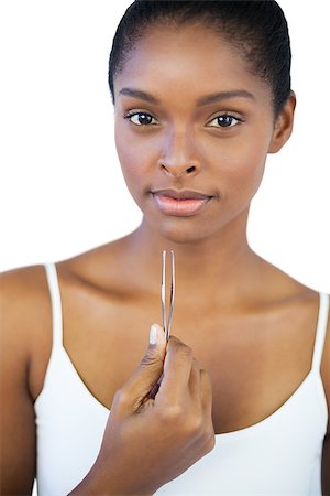 simsearch:400-06890736,k - Woman holding her tweezers on white background Stock Photo - Budget Royalty-Free & Subscription, Code: 400-06890754