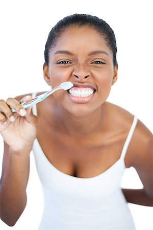 simsearch:400-06890736,k - Woman brushing her teeth on white background Stock Photo - Budget Royalty-Free & Subscription, Code: 400-06890776