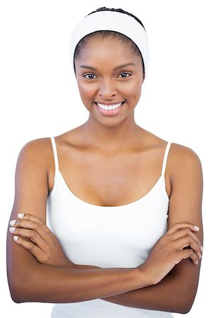 simsearch:400-06890736,k - Smiling woman with headband crossing her arms on white background Stock Photo - Budget Royalty-Free & Subscription, Code: 400-06890791