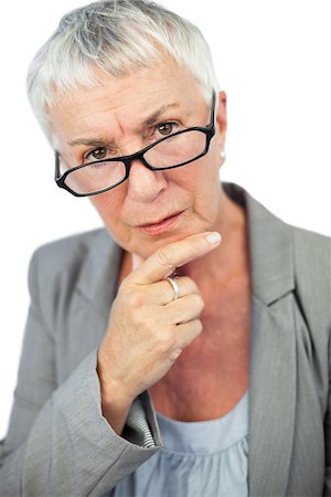 simsearch:614-07240033,k - Thinking mature woman wearing glasses on white background Photographie de stock - Aubaine LD & Abonnement, Code: 400-06890831