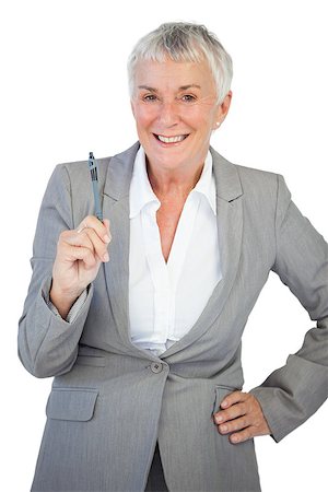 Businesswoman with hand on hip holding pen on white background Stock Photo - Budget Royalty-Free & Subscription, Code: 400-06890883