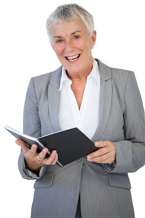 Cheerful businesswoman holding notepad on white background Stock Photo - Budget Royalty-Free & Subscription, Code: 400-06890890