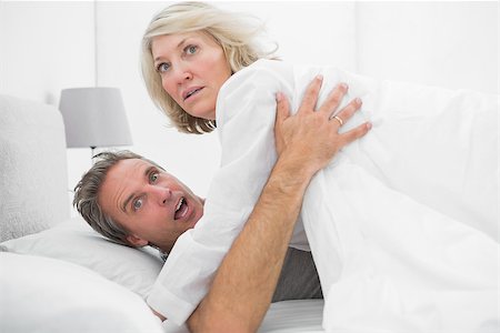 Shocked couple caught in the act at home in bed Stock Photo - Budget Royalty-Free & Subscription, Code: 400-06891129