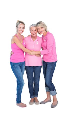simsearch:400-06870717,k - Smiling women wearing pink tops and ribbons for breast cancer on white background Stock Photo - Budget Royalty-Free & Subscription, Code: 400-06891588