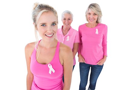 simsearch:400-06870717,k - Three generations of women wearing pink tops and breast cancer ribbons on white background Stock Photo - Budget Royalty-Free & Subscription, Code: 400-06891593