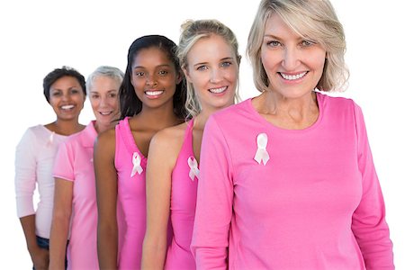 Cheerful women wearing pink and ribbons for breast cance on white background Foto de stock - Super Valor sin royalties y Suscripción, Código: 400-06891621