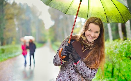 laughing girl and walking couple under rainfall in autumn park Stock Photo - Budget Royalty-Free & Subscription, Code: 400-06891701