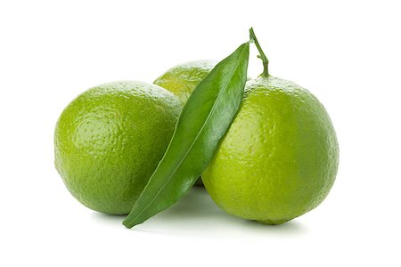 simsearch:400-05128284,k - Three ripe limes with leaf. Isolated on white Foto de stock - Super Valor sin royalties y Suscripción, Código: 400-06914055