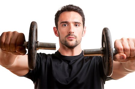 simsearch:400-06914161,k - Personal Trainer doing front dumbell raises for training his deltoids, isolated in white Photographie de stock - Aubaine LD & Abonnement, Code: 400-06914162