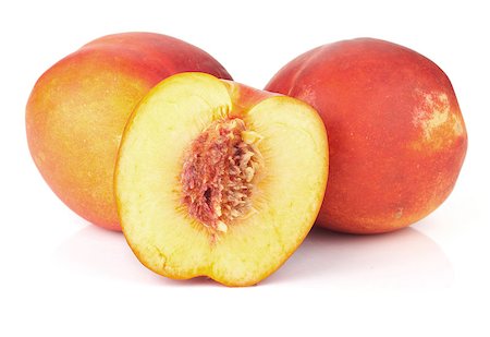 Ripe peach fruits. Isolated on white background Photographie de stock - Aubaine LD & Abonnement, Code: 400-06914284