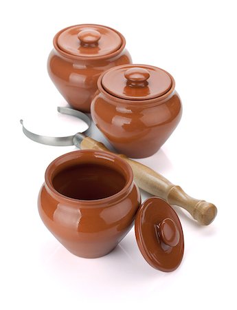 pot holder - Three clay pots and holder. Isolated on white background Stock Photo - Budget Royalty-Free & Subscription, Code: 400-06914576