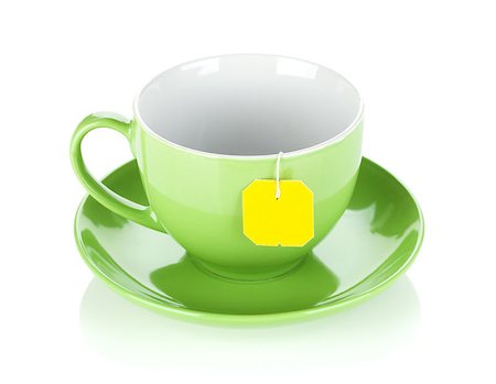 simsearch:628-02615924,k - Green tea cup and teabag. Isolated on white background Foto de stock - Royalty-Free Super Valor e Assinatura, Número: 400-06914644