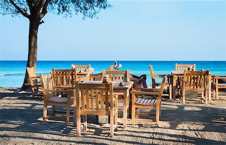 simsearch:400-06914796,k - Cafe on a tropical beach with blue sea on background Stock Photo - Budget Royalty-Free & Subscription, Code: 400-06914795