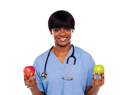 Female doctor showing fresh red and green apples on white background Stock Photo - Budget Royalty-Free & Subscription, Code: 400-06914821