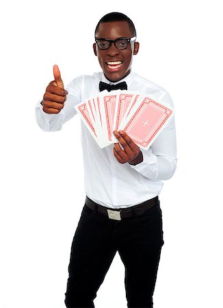 Handsome smiling man holding a trump showing thumbs up Stock Photo - Budget Royalty-Free & Subscription, Code: 400-06914877