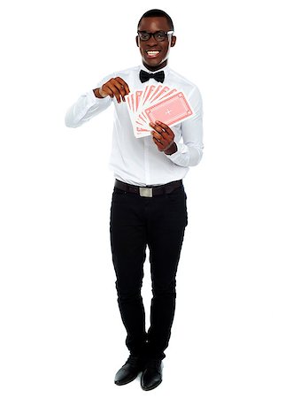 Full length portrait of a young man holding cards Stock Photo - Budget Royalty-Free & Subscription, Code: 400-06914880