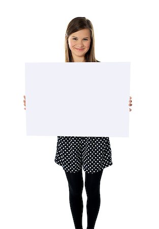 simsearch:400-06695536,k - Smiling cute isolated girl displaying blank white poster Stock Photo - Budget Royalty-Free & Subscription, Code: 400-06914923