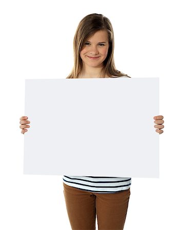 simsearch:400-06695536,k - Smiling teenager showing blank billboard isolated against white background Stock Photo - Budget Royalty-Free & Subscription, Code: 400-06914944