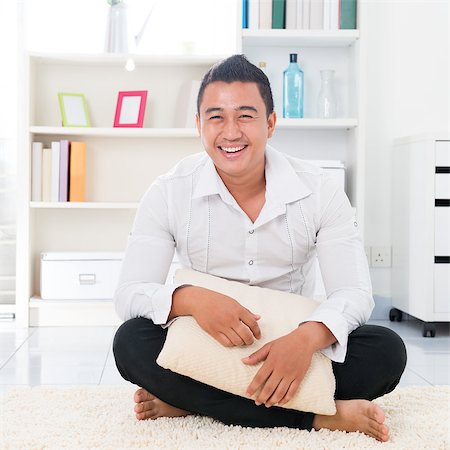 Young Asian man smiling happy. Lifestyle Southeast Asian man at home. Handsome Asian male model. Stock Photo - Budget Royalty-Free & Subscription, Code: 400-06915041
