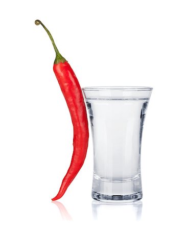 Shot of vodka and red hot chili pepper. Isolated on white background Stock Photo - Budget Royalty-Free & Subscription, Code: 400-06915368