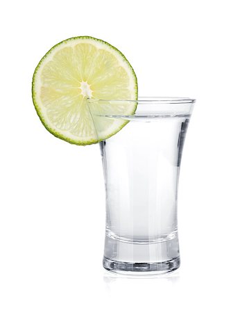 simsearch:400-06914551,k - Shot of vodka and lime slice. Isolated on white background Stock Photo - Budget Royalty-Free & Subscription, Code: 400-06915369