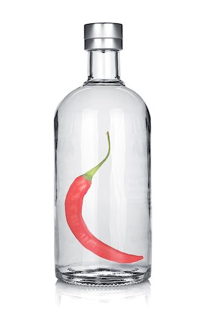 simsearch:400-06914551,k - Bottle of vodka with red chili pepper. Isolated on white background Stock Photo - Budget Royalty-Free & Subscription, Code: 400-06915377