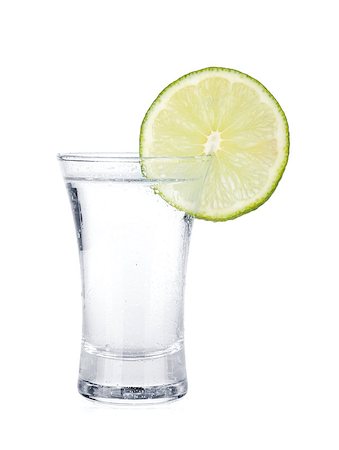 simsearch:400-06914551,k - Shot of vodka and lime slice. Isolated on white background Stock Photo - Budget Royalty-Free & Subscription, Code: 400-06915370
