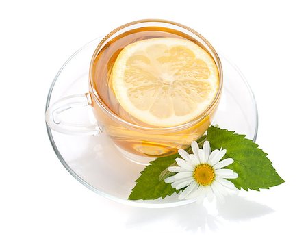 simsearch:400-08186432,k - Cup of tea with lemon slice, mint leaves and chamomile flower. Isolated on white background Stock Photo - Budget Royalty-Free & Subscription, Code: 400-06915492