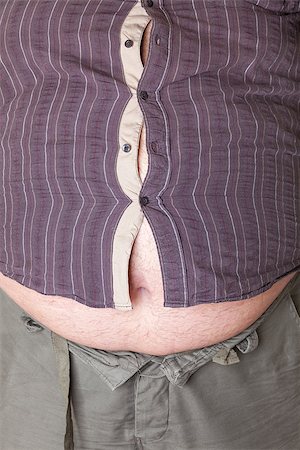 simsearch:400-06108048,k - Fat man with a big belly, close-up part of the body Stockbilder - Microstock & Abonnement, Bildnummer: 400-06915549