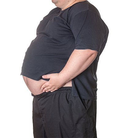 simsearch:400-06108048,k - Fat man with a big belly, close-up part of the body Stockbilder - Microstock & Abonnement, Bildnummer: 400-06915554